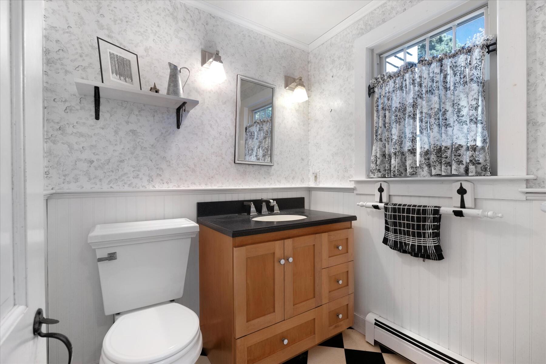 307 Bank Street Harwich, MA 02645 - Photo 6 of 45 a bathroom with a granite countertop toilet sink and mirror