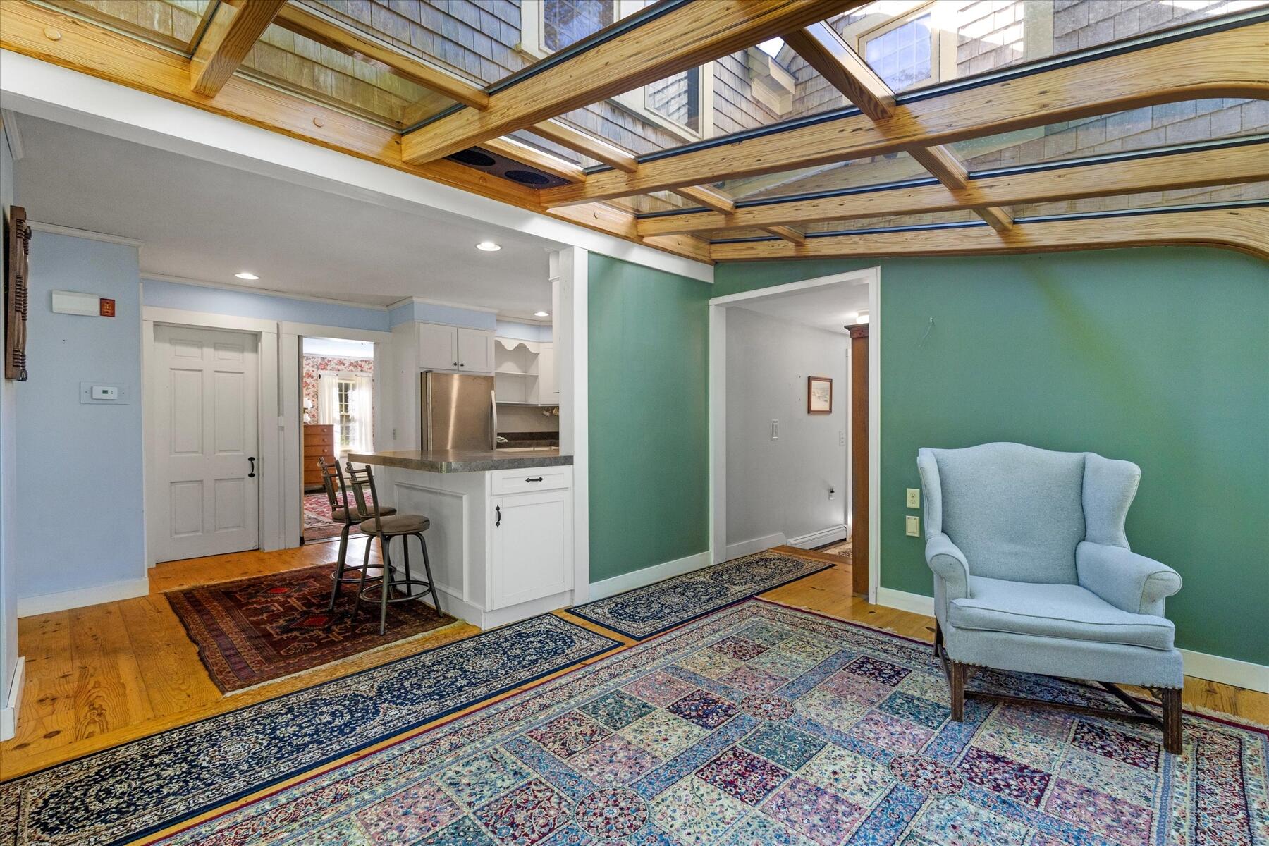 307 Bank Street Harwich, MA 02645 - Photo 8 of 45 a living room with furniture and a rug