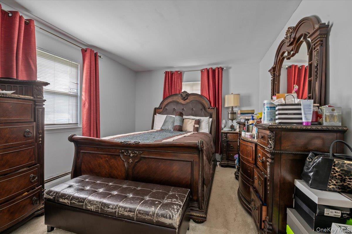 7 Bennett Court Copiague, NY 11726 - Photo 17 of 22 a living room with furniture and a fireplace