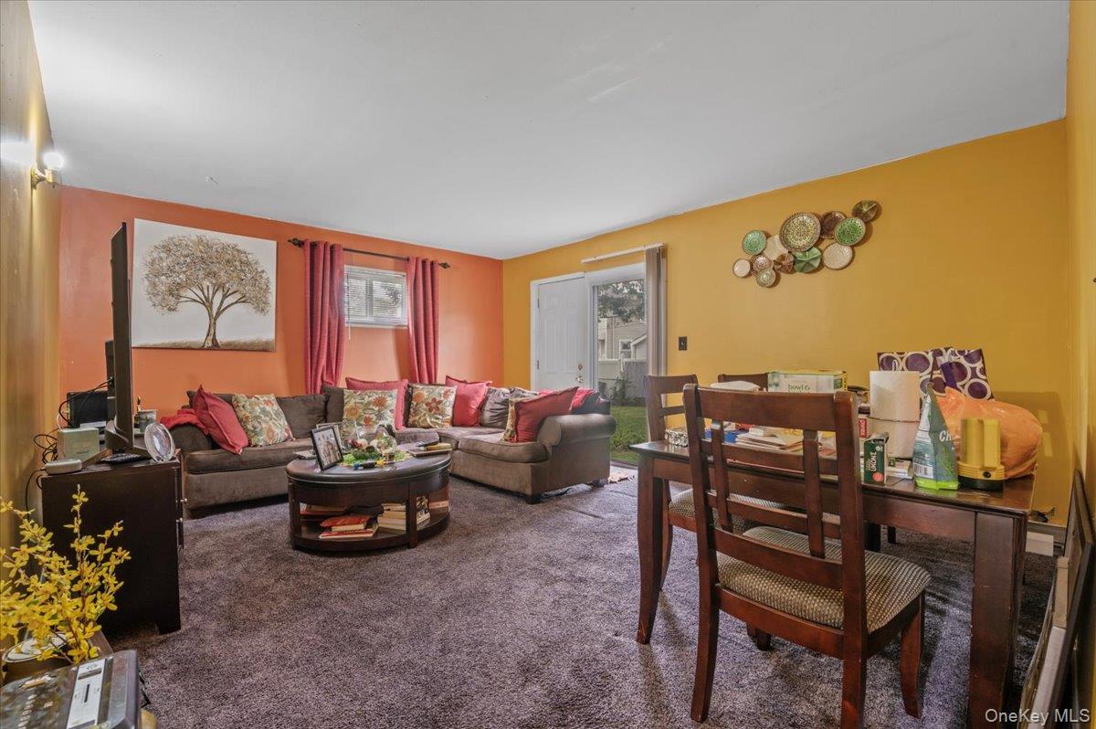 7 Bennett Court Copiague, NY 11726 - Photo 18 of 22 a living room with furniture and a large window