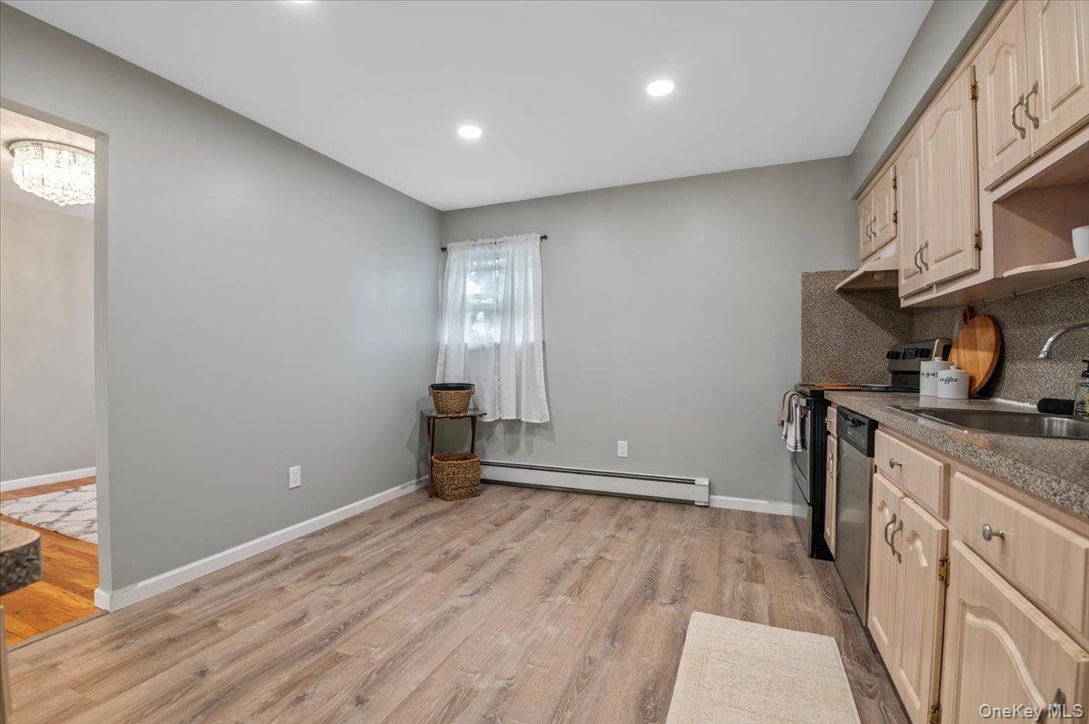 7 Bennett Court Copiague, NY 11726 - Photo 9 of 22 a view of a kitchen with a sink and dishwasher stove