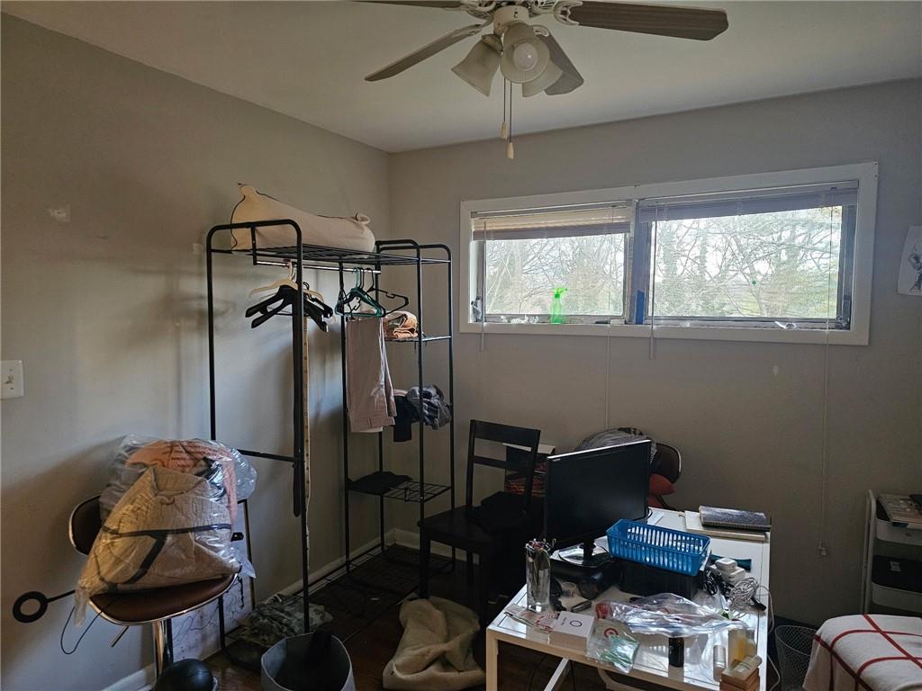 5341 Old Floyd Road Southwest Mableton, GA 30126 - Photo 8 of 8 a view of a workspace with furniture and a window