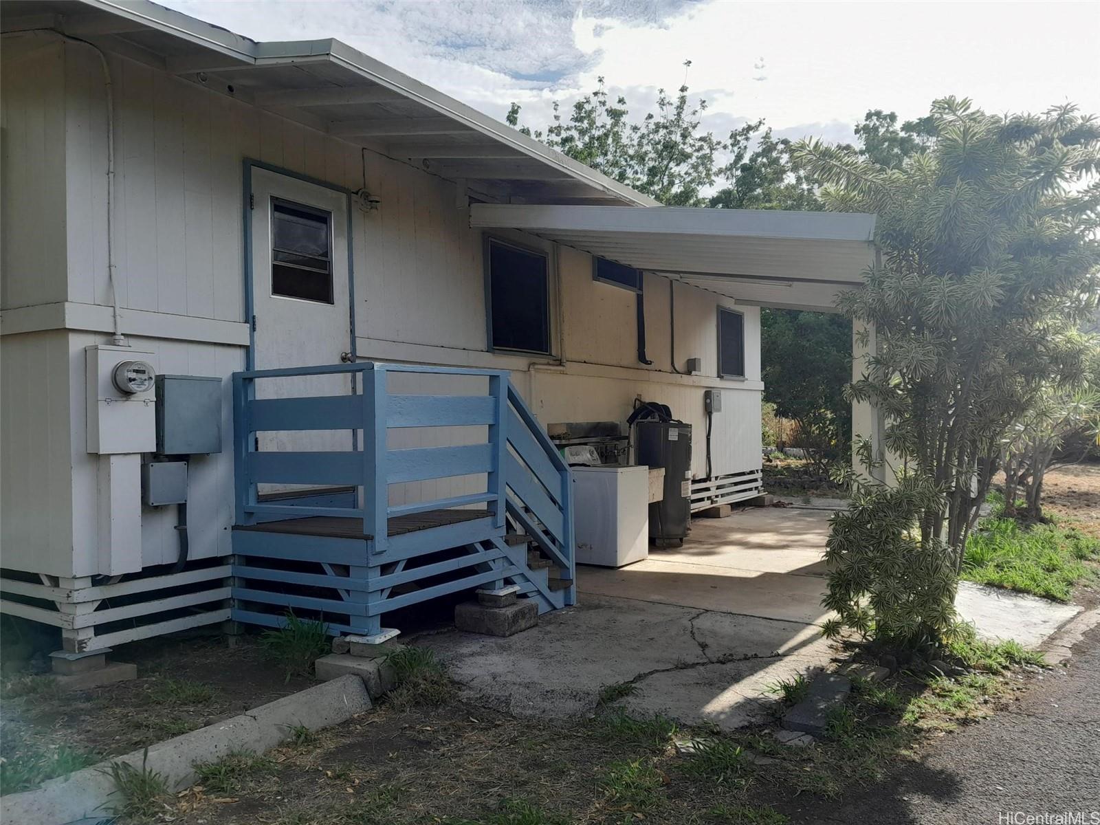 85-775A Waianae Valley Road Waianae, HI 96792 - Photo 11 of 25 a view of a house with a yard