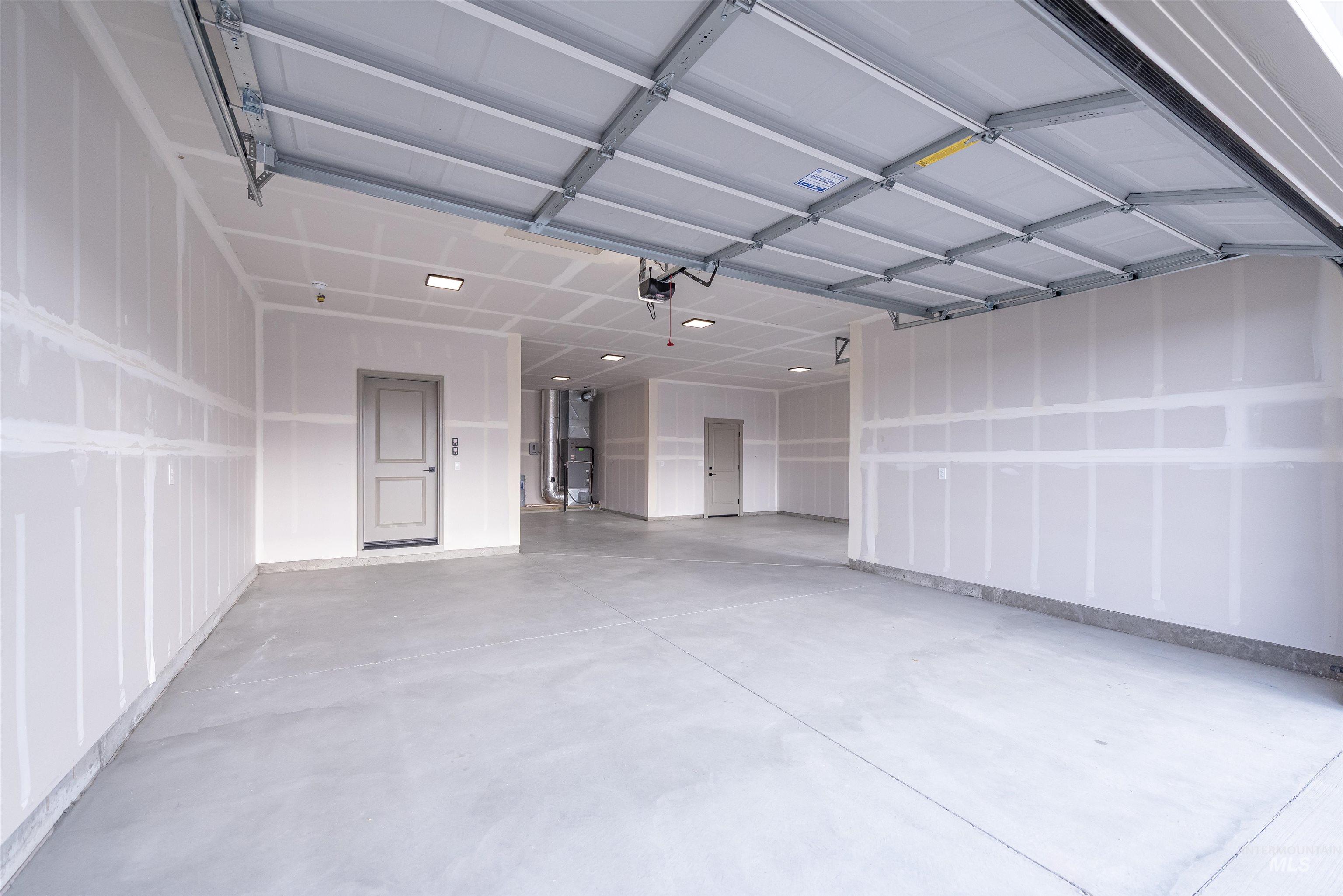 360 South Bumper Way Boise, ID 83716 - Photo 31 of 34 Garage featuring heating unit