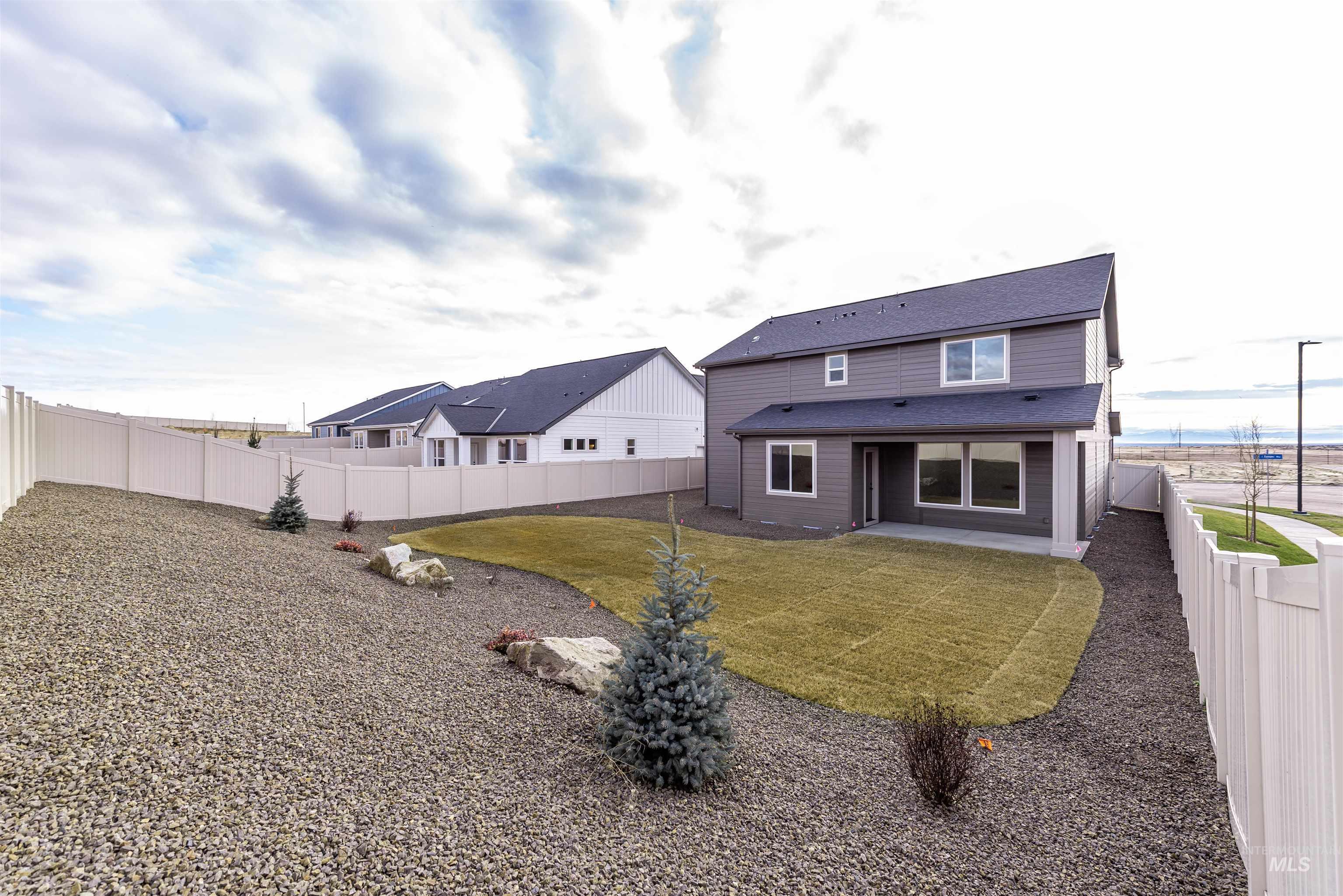 360 South Bumper Way Boise, ID 83716 - Photo 33 of 34 Rear view of property featuring a patio and a fenced backyard