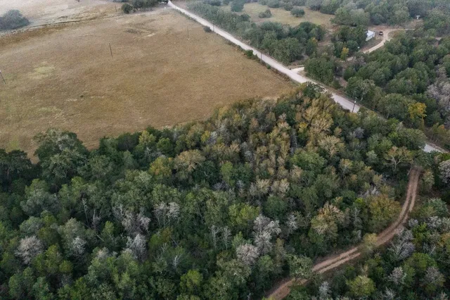 an aerial view of house with yard