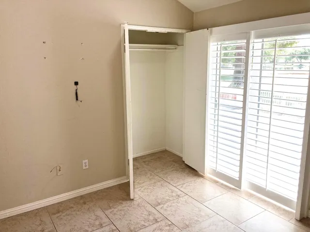 a view of an empty room with a window