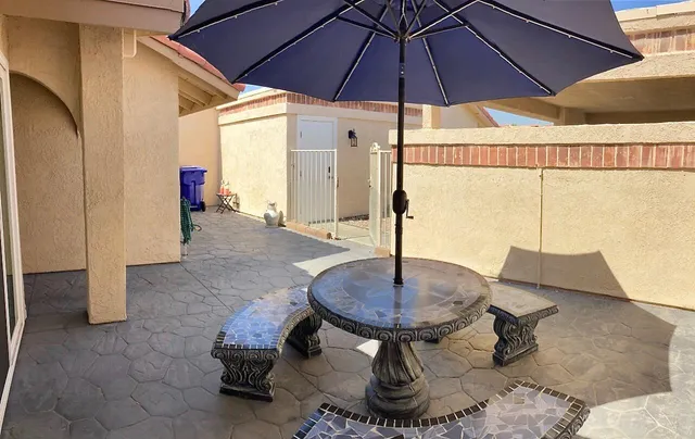 a table and chairs in a patio