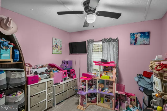 a room with furniture and a flat screen tv