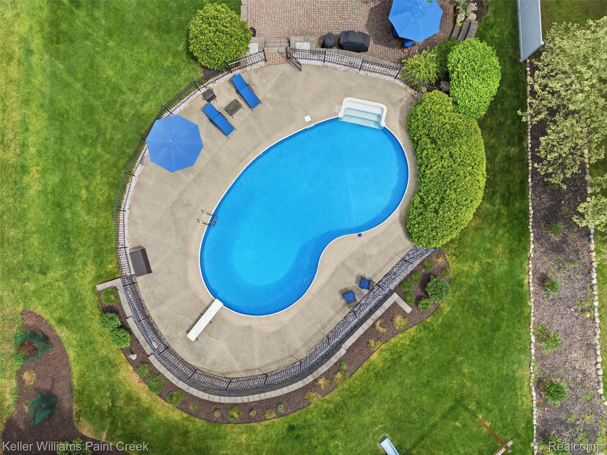 1351 West Fairview Lane Rochester, MI 48306 - Photo 6 of 65 View of pool with patio surround, a yard, and a diving board