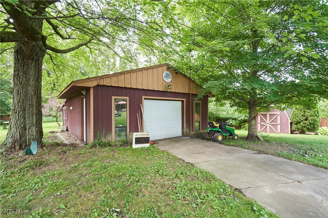 90 Johnson Road Wadsworth, OH 44281 - Photo 22 of 22 Garage featuring concrete driveway and heating unit