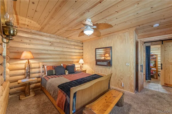 a bedroom with a bed and a walk in closet