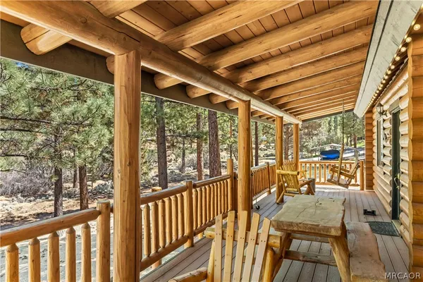 a view of a backyard with sitting area