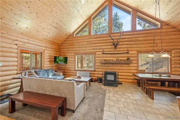 a outdoor living space with patio furniture and a fireplace