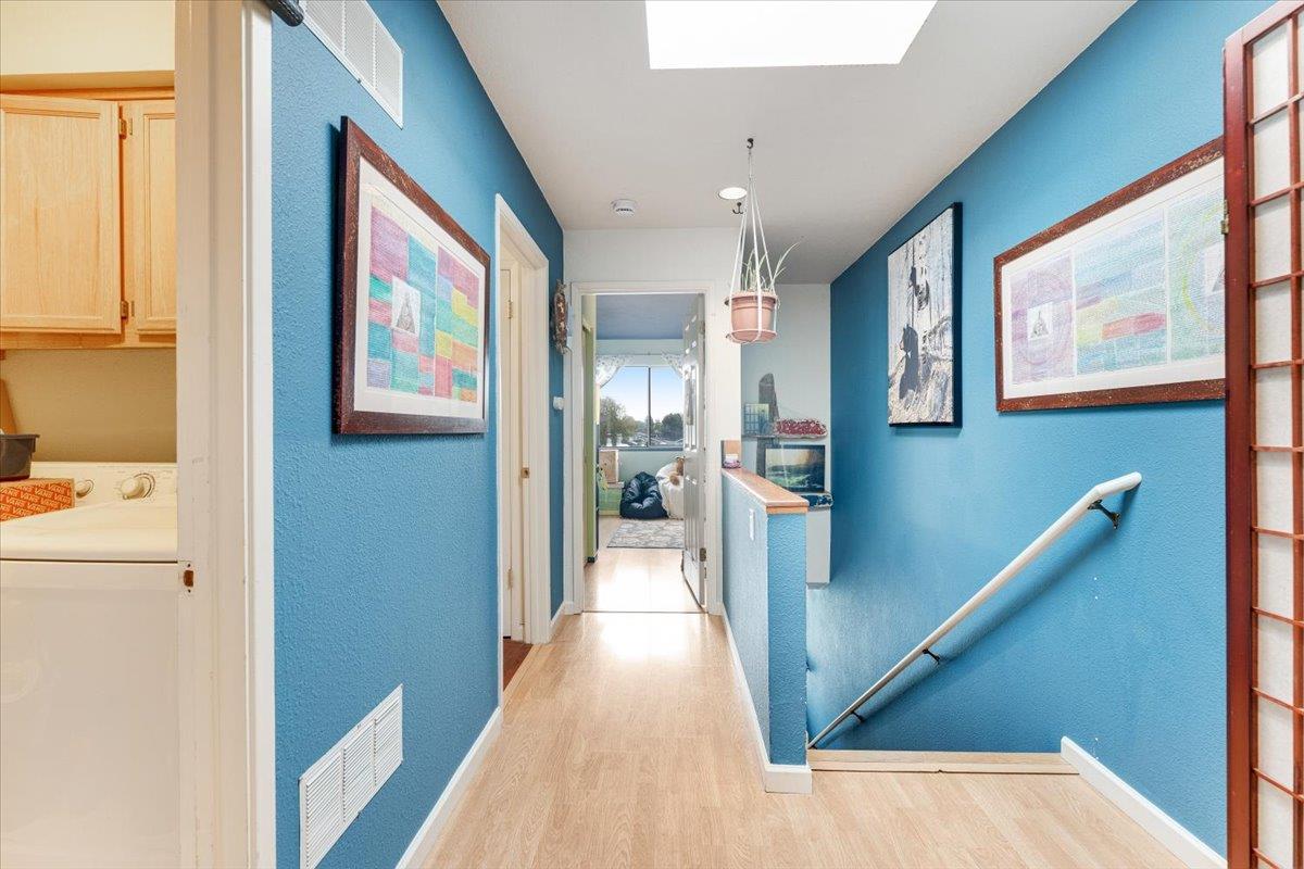 7245 Lotus Way Aptos, CA 95003 - Photo 12 of 20 a view of hallway with stairs and wooden floor