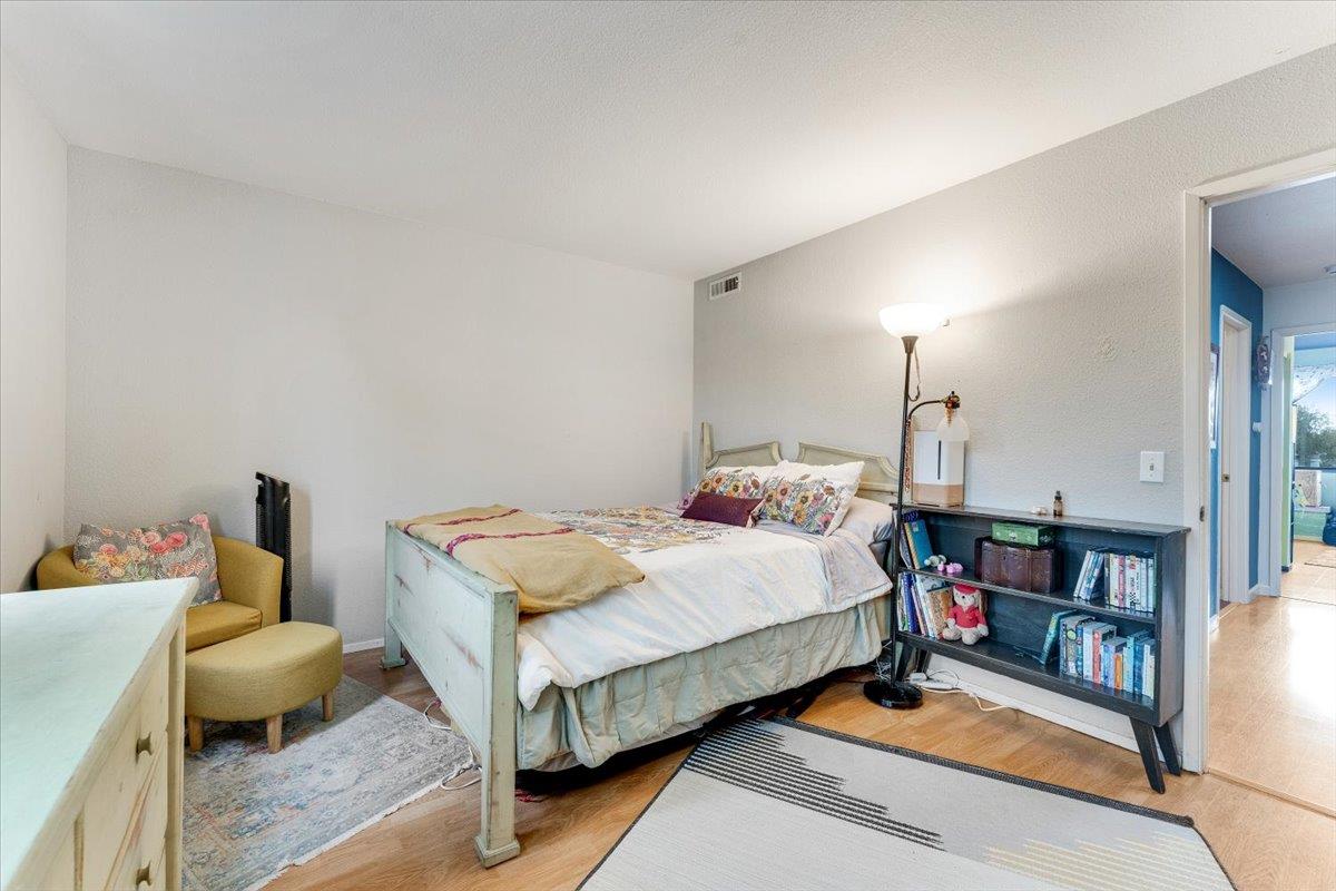 7245 Lotus Way Aptos, CA 95003 - Photo 14 of 20 a bedroom with bed and a book shelf