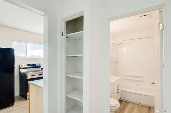 a bathroom with a shower toilet and sink