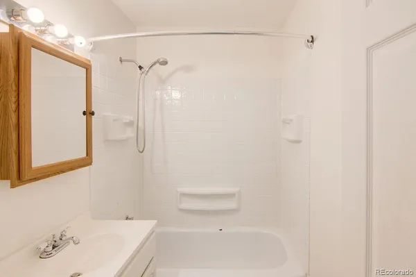 a bathroom with a bathtub and a sink