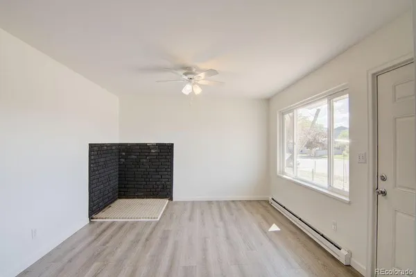 a view of an empty room with a window