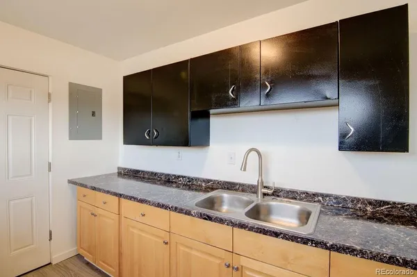 a kitchen with a sink and cabinets