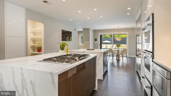 a view of a swimming pool with a yard and sitting area