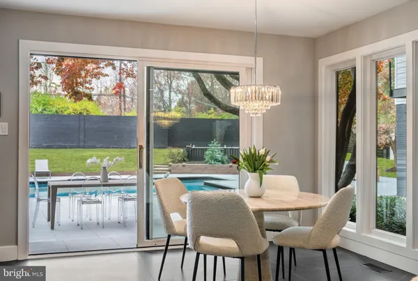 a living room with furniture and a large window with outer view