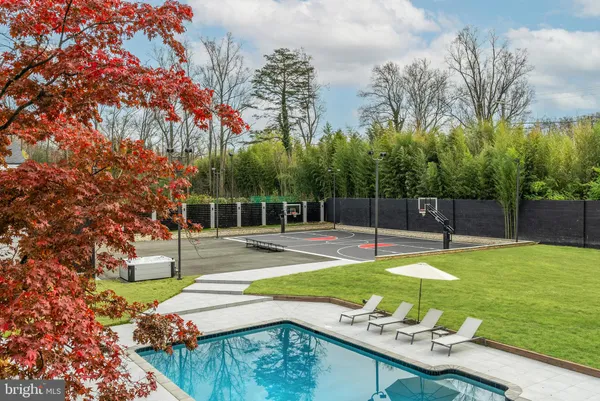 a bathroom with a sink vanity mirror and toilet