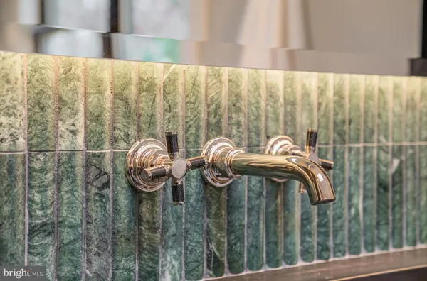 a utility room with sink dryer and washer