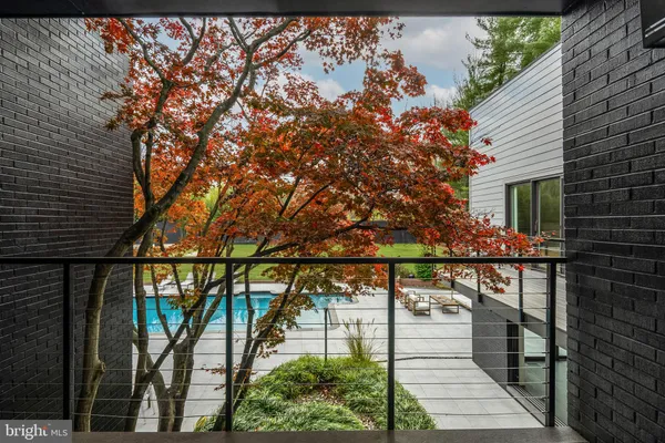 a living room with a couch and a painting on the wall