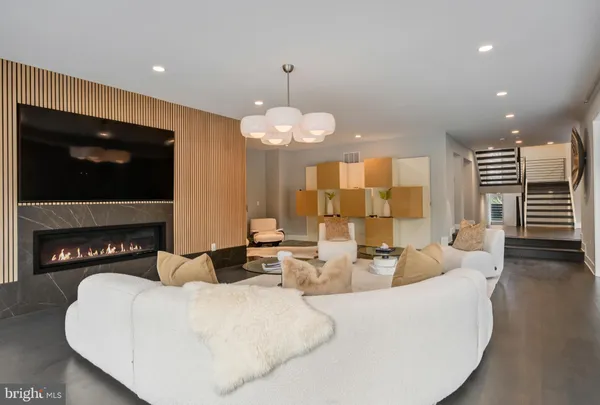 a dining area with stainless steel appliances granite countertop a dining table chairs and granite counter tops