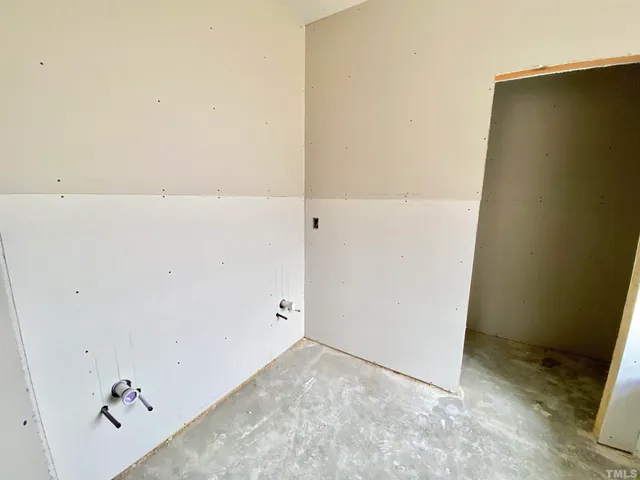 a bathroom with a tub shower and toilet