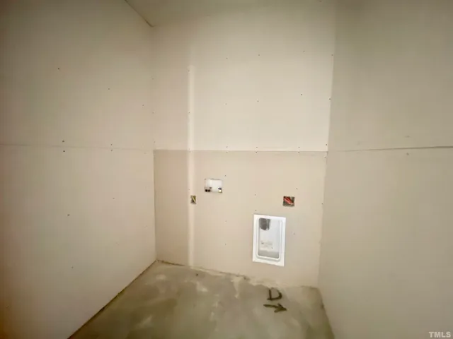 a view of a hallway with windows and cabinet