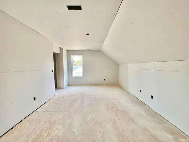 an empty room with mirror