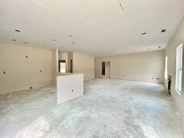 a view of a big room with window and cabinet