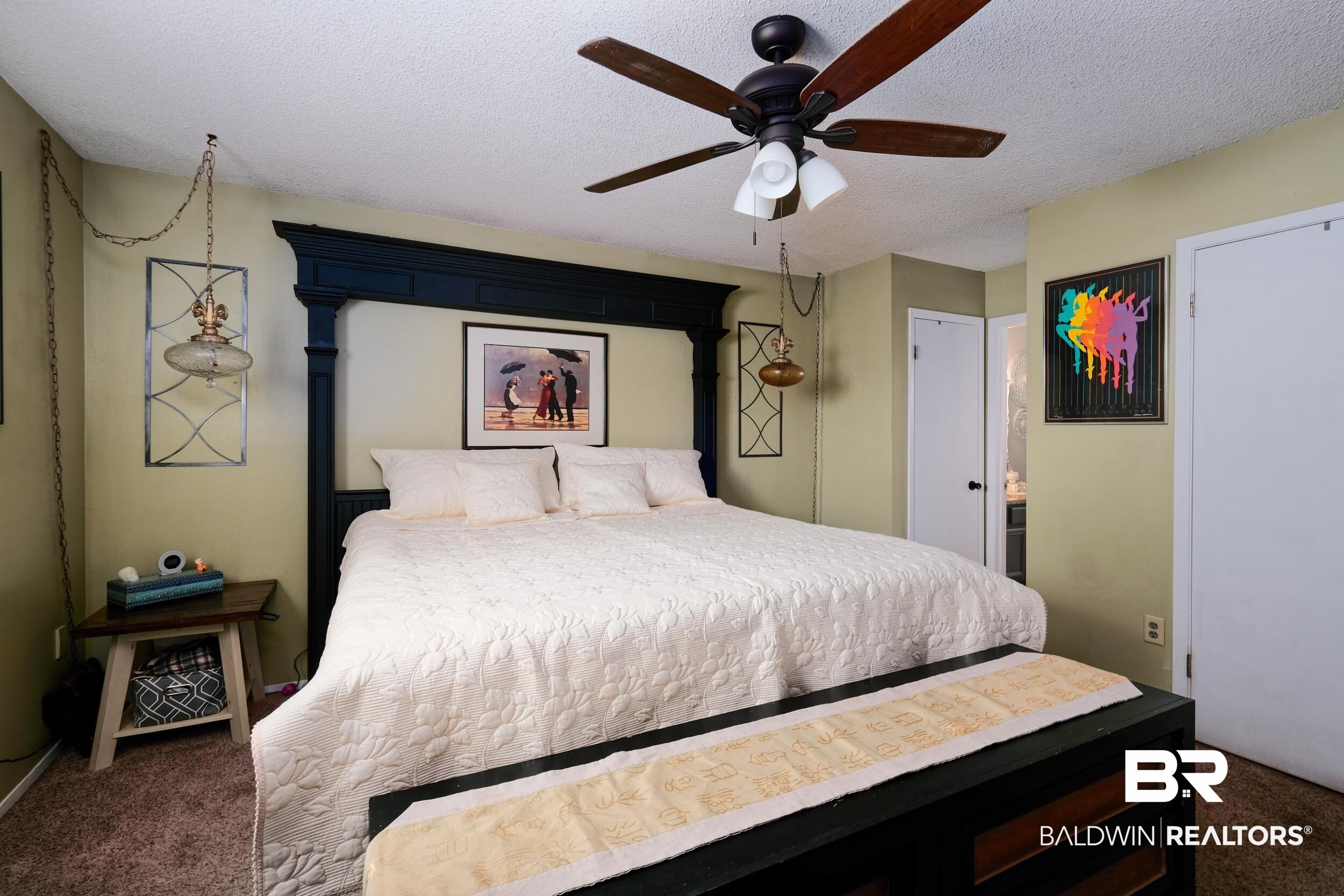 504 Ariel Avenue Foley, AL 36535 - Photo 22 of 33 Carpeted bedroom featuring a textured ceiling and ceiling fan