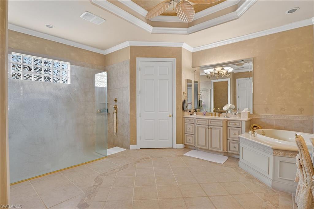 1964 Rialto Way Alva, FL 33920 - Photo 21 of 50 a bathroom with a bathtub a shower a sink and a mirror