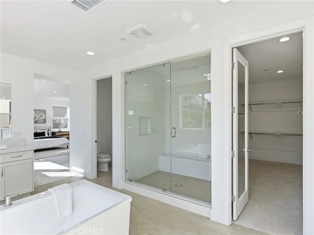 a bathroom with a shower and a sink
