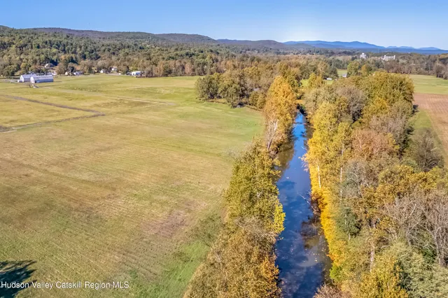a view of a lake with a big yard
