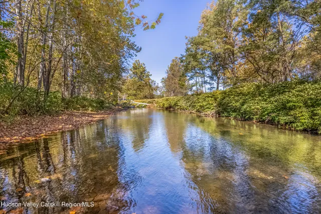 a view of an ocean from a mountain