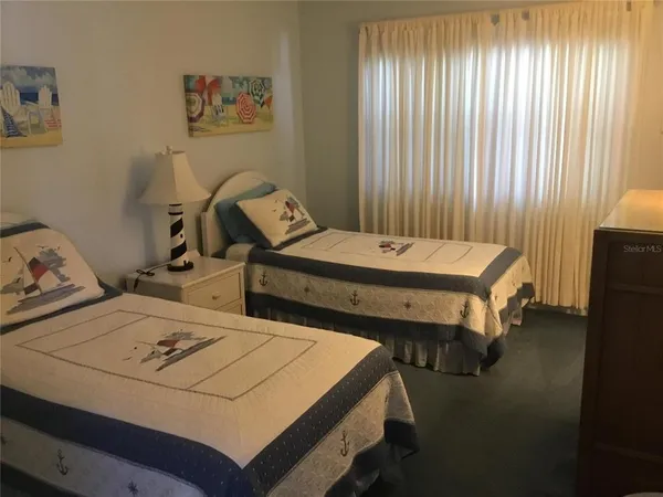 a bed room with a bed and a table