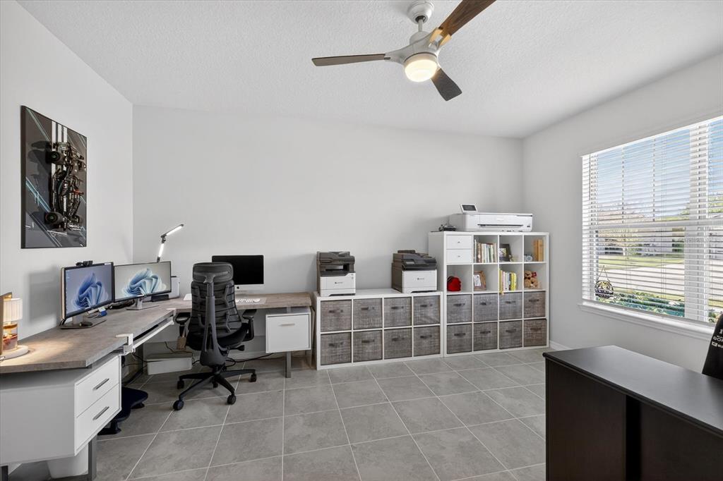 12740 Palapa Loop Spring Hill, FL 34610 - Photo 14 of 68 a view of a workspace with furniture and a window