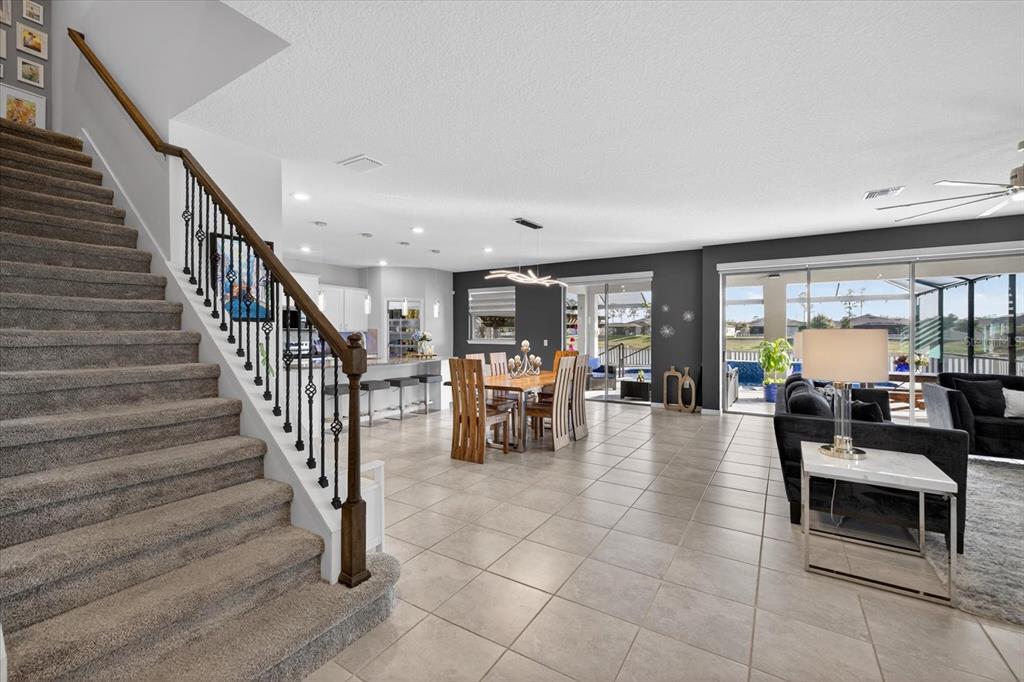 12740 Palapa Loop Spring Hill, FL 34610 - Photo 19 of 68 a living room with furniture and large windows