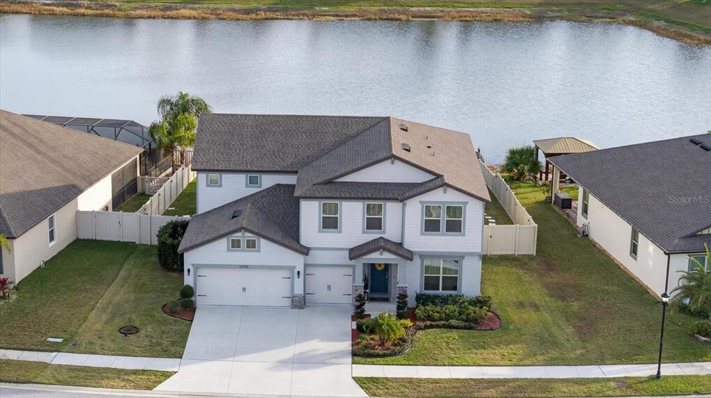 12740 Palapa Loop Spring Hill, FL 34610 - Photo 4 of 68 an aerial view of a house with a yard