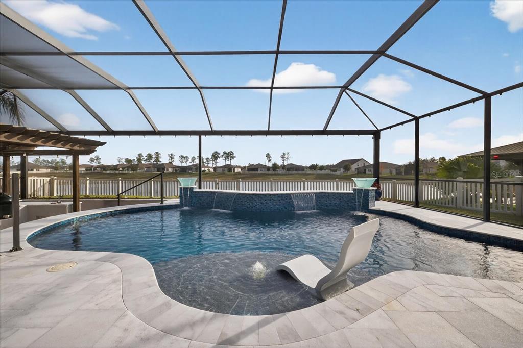 12740 Palapa Loop Spring Hill, FL 34610 - Photo 51 of 68 a view of a living room and a floor to ceiling window