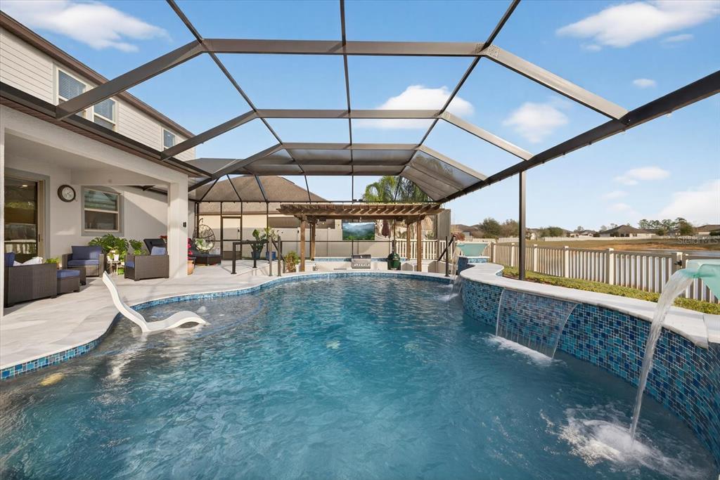 12740 Palapa Loop Spring Hill, FL 34610 - Photo 53 of 68 a view of a swimming pool with a patio