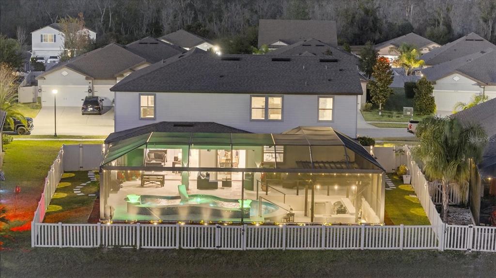 12740 Palapa Loop Spring Hill, FL 34610 - Photo 60 of 68 an aerial view of a residential apartment building with a swimming pool
