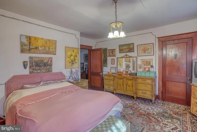 a front view of a house with outdoor seating