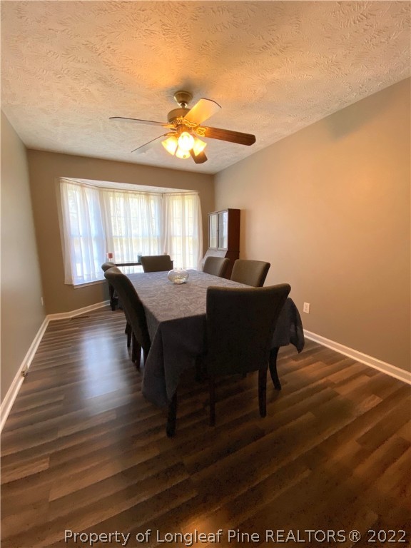 271 Stone Cross Drive Spring Lake, NC 28390 - Photo 14 of 38 a view of a dining room with furniture and window