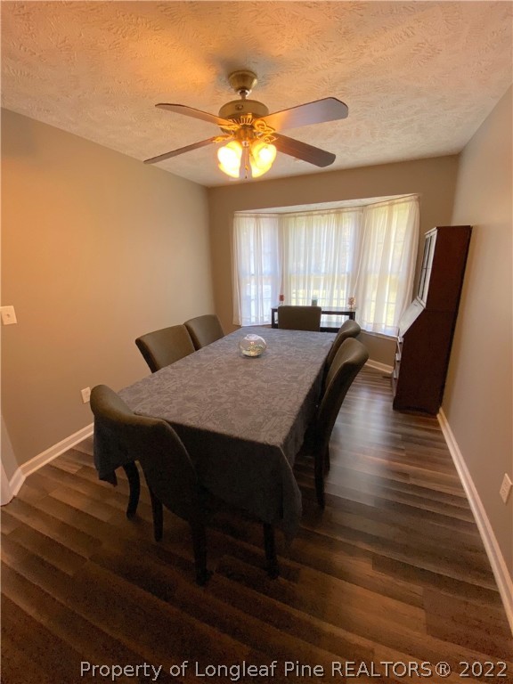271 Stone Cross Drive Spring Lake, NC 28390 - Photo 15 of 38 a view of a dining room with furniture and window
