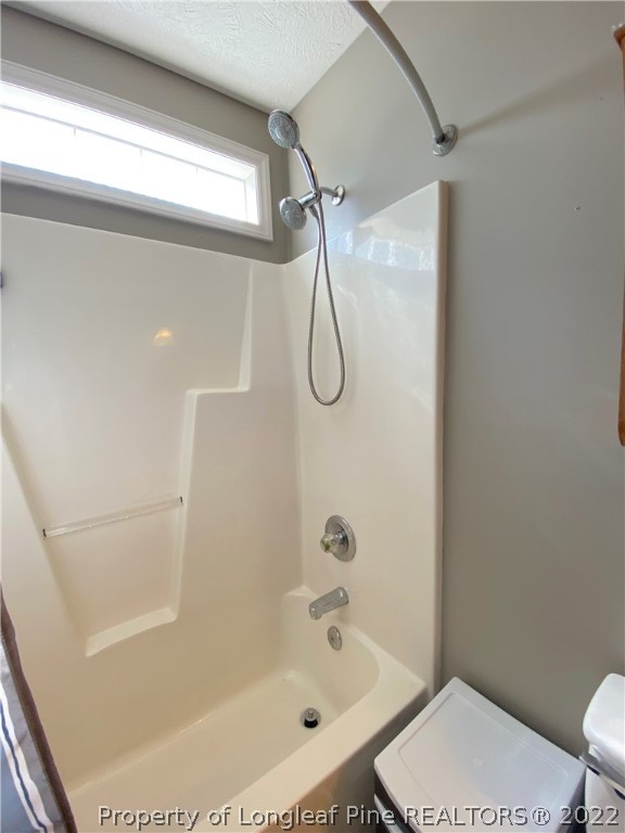 271 Stone Cross Drive Spring Lake, NC 28390 - Photo 26 of 38 a bathroom with a bath tub with a shower